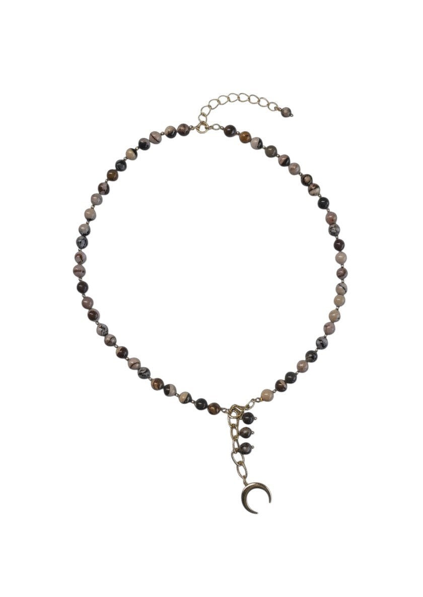 cudoVnia.pl beaded necklace with earthy toned beads and a gold-tone crescent moon charm pendant.